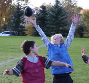 A flag football player goes for a circus catch!