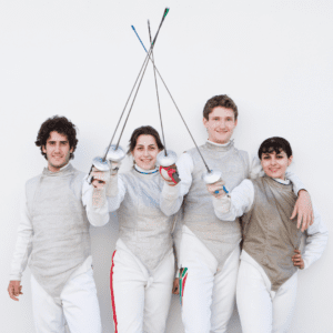 Four fencers posing with their fencing weapons.