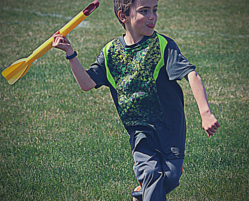 Track and Field class for kids. A student about to throw a javelin.