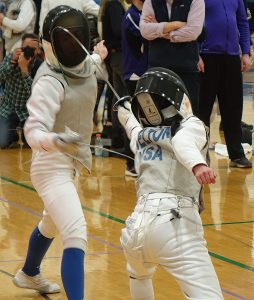 YEL FC club member delivers an epic attack against an opponent. The fencing foil is bent perfectly at the point of attack.